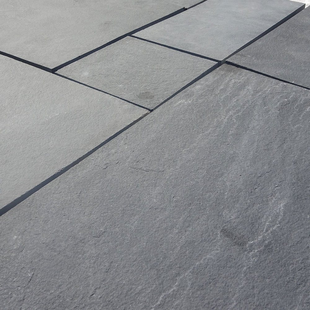 1751876050_KOTA-BLACK-LIMESTONE-RIVEN-PAVING-MIX-PATIO-1.jpg